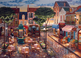 A beautifully illustrated jigsaw puzzle depicting a charming cafe scene in an evening setting. The image features quaint buildings with intricate details, outdoor seating with round tables draped in pink tablecloths, vibrant flower arrangements, and a glimmering light post. There's a fountain in the background and the silhouette of the Eiffel Tower peeking over the rooftops, creating a romantic ambiance. Perfect for puzzle enthusiasts who appreciate art and café culture.