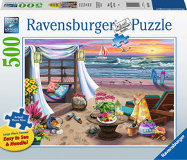 A vibrant Ravensburger jigsaw puzzle depicting a serene seaside retreat. The image features a cozy beach scene with a hammock, colorful flowers, a table set with snacks, lounge chairs, and surfboards near a scenic ocean view. The sky is painted with warm sunset colors, adding a peaceful ambiance to the puzzle.