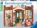 Cover of the Wordsmith's Bookshop jigsaw puzzle by Ravensburger, depicting a charming bookstore entrance filled with books, decorative items, and a black cat. The detailed illustration showcases various elements of a cozy bookshop, inviting puzzle enthusiasts to enjoy piecing it together. The box prominently displays the Ravensburger logo and puzzle piece, indicating quality and craftsmanship.
