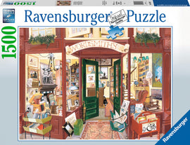 Cover of the Wordsmith's Bookshop jigsaw puzzle by Ravensburger, depicting a charming bookstore entrance filled with books, decorative items, and a black cat. The detailed illustration showcases various elements of a cozy bookshop, inviting puzzle enthusiasts to enjoy piecing it together. The box prominently displays the Ravensburger logo and puzzle piece, indicating quality and craftsmanship.