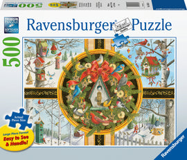 A Ravensburger jigsaw puzzle titled 'Christmas Songbirds' featuring a festive collage of colorful songbirds, birdhouses, and holiday decorations. The design includes a central birdhouse adorned with a large red bow, surrounded by greenery and playful birds in various winter scenes. This premium 500-piece puzzle is perfect for holiday enthusiasts and puzzle lovers alike.