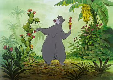 The Disney Vault: Baloo jigsaw puzzle features the iconic bear Baloo surrounded by lush tropical vegetation and vibrant plants. Baloo joyfully holds fruit and stands in a lively jungle setting, capturing a delightful moment from Disney's classic animation.