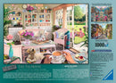 A beautifully illustrated jigsaw puzzle titled 'The Tea Shed' by Ravensburger. The image depicts a cozy tea house interior adorned with floral arrangements, colorful teapots, and comfortable seating. A person is enjoying tea with a dog at their feet, reflecting a warm and inviting atmosphere. Sunlight filters through large windows, illuminating the details of this serene setting, making it a perfect retreat for relaxation.