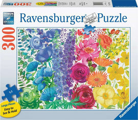 A colorful jigsaw puzzle box featuring a vibrant floral design with an assortment of flowers, including roses, lilies, and daisies. The puzzle is made by Ravensburger and includes 300 large pieces that are easy to see and handle, showcasing the Softclick technology for a premium puzzling experience.