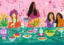 A vibrant jigsaw puzzle illustration entitled 'Ladies' Brunch' by Ravensburger. The scene features four women enjoying brunch at a beautifully arranged table filled with colorful dishes and drinks. In the background, pink flowers and greenery create a lively atmosphere, enhancing the joyful brunch theme.