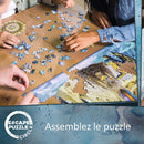 A group of people working together on the Escape the Circle: Rome jigsaw puzzle. Pieces in various colors and shapes are scattered on a wooden table, with sections of the puzzle already assembled showcasing intricate designs and themes from Rome. The puzzle combines fun and challenge as participants collaborate to complete it.
