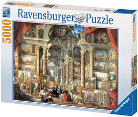 A jigsaw puzzle box featuring 'Views of Modern Rome' by Ravensburger. The design showcases a detailed artwork filled with classical architecture and scenes of Rome, including columns, statues, and people engaged with the art. The box includes a vibrant illustration of the completed puzzle, emphasizing its intricate design and rich details, suitable for puzzle enthusiasts and lovers of art.