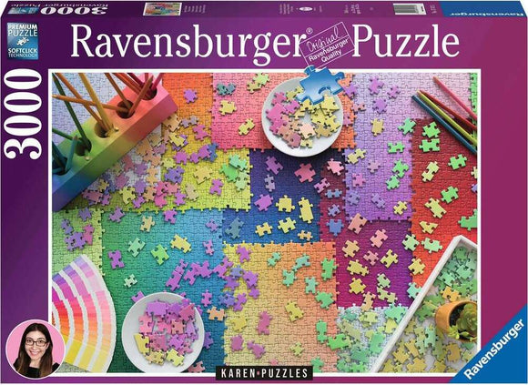 Ravensburger 3000-piece jigsaw puzzle titled 'Karen Puzzles on Puzzles'. The image features a colorful array of interlocking puzzle pieces spread out on a vibrant, patterned surface, alongside art supplies like colored pencils and paint swatches, showcasing a creative atmosphere ideal for puzzle enthusiasts.