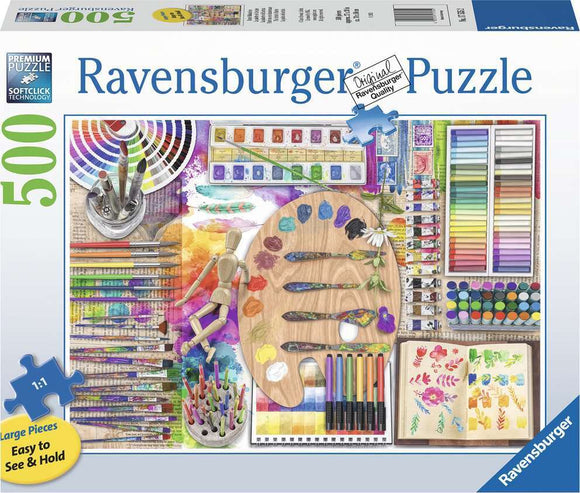 The Artist's Palette Large Piece Puzzle by Ravensburger featuring a colorful assortment of art supplies including paint tubes, brushes, a palette with paint spots, and a sketchbook filled with floral designs. The puzzle showcases vibrant colors and a creative theme, ideal for art lovers.
