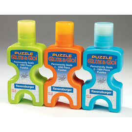 Three bottles of Ravensburger Puzzle Glue & Go! in vibrant colors: green, orange, and blue. Each bottle is designed to permanently seal up to two 1000-piece jigsaw puzzles, featuring easy-to-use dispensing caps for convenient application.