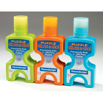 Three bottles of Ravensburger Puzzle Glue & Go! in vibrant colors: green, orange, and blue. Each bottle is designed to permanently seal up to two 1000-piece jigsaw puzzles, featuring easy-to-use dispensing caps for convenient application.