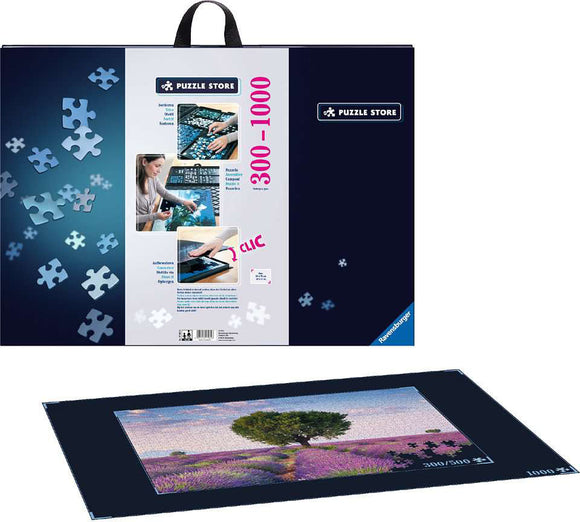 Ravensburger Puzzle Store Accessory jigsaw puzzle kit with visuals showing a detailed setup for assembling jigsaw puzzles. The packaging features vivid images of puzzle pieces and a completed jigsaw scene of a tree amidst lavender fields. The kit is designed for puzzles with 300 to 1000 pieces and includes innovative storage and assembly solutions.
