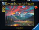 Ravensburger jigsaw puzzle titled 'Alberta's Three Sisters', featuring a scenic landscape of the Canadian Rockies at sunset, showcasing vibrant colors with mountains, trees, and a lake. The package contains 1000 pieces, designed for puzzle enthusiasts and nature lovers.