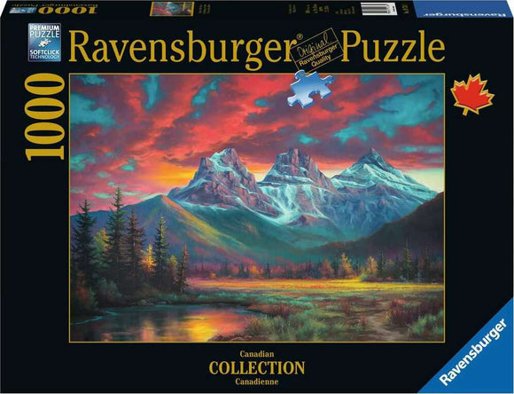 Ravensburger jigsaw puzzle titled 'Alberta's Three Sisters', featuring a scenic landscape of the Canadian Rockies at sunset, showcasing vibrant colors with mountains, trees, and a lake. The package contains 1000 pieces, designed for puzzle enthusiasts and nature lovers.