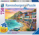 Ravensburger jigsaw puzzle titled 'Romantic Sunset' featuring a picturesque coastal scene. The image showcases vibrant colors of the sunset reflecting on the water, charming buildings along the shore, and boats moored in the bay. The puzzle has 750 pieces and measures 32x24 inches, designed for easy handling with large pieces.
