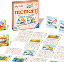 The product features a memory card game titled 'my first memory®: Vehicles' by Ravensburger. The game includes colorful illustrated cards showcasing various vehicles like an ambulance, an airplane, and construction machinery. The game box is prominently displayed and the cards are laid out in rows, inviting young players to match pairs and enhance their memory skills. It's designed for children aged 2 and up.