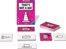 That's Not a Hat game by Ravensburger displayed with its box and several cards. The pink box features the game title prominently, and various cards showing illustrations like a traffic cone and cake are arranged in front.