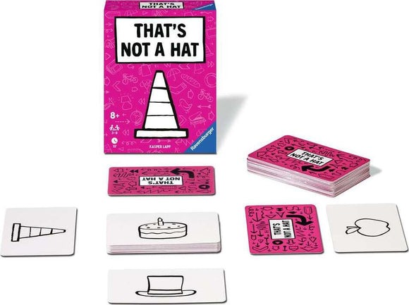 That's Not a Hat game by Ravensburger displayed with its box and several cards. The pink box features the game title prominently, and various cards showing illustrations like a traffic cone and cake are arranged in front.