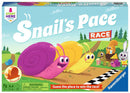 Box cover for the game 'Snail's Pace Race' by Ravensburger. The illustration features colorful cartoon snails racing along a pathway, surrounded by cheerful animal characters in a vibrant outdoor setting. The title is prominently displayed, and a warning label about small parts is included at the bottom.