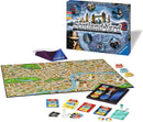 Scotland Yard game by Ravensburger, featuring a large map of London, game pieces, a Mister X blindfold, cards, and a smartphone app for gameplay. The box showcases iconic landmarks and images related to the game's theme.