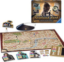 A board game titled 'Scotland Yard: Sherlock Holmes Edition' by Ravensburger, featuring a colorful game board of London, character pieces including Sherlock Holmes and Dr. Watson, a magnifying glass, and various game tokens. The box shows the game's title and images of characters from the story.