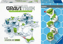 The GraviTrax Speed Set by Ravensburger features a dynamic, interactive track system. The game includes different track pieces, marbles, and accessories that allow players to build and create their own gravity-powered marble runs, enhancing creativity and problem-solving skills. The design showcases a variety of hexagonal shapes and components in bright colors like green, red, and blue, perfect for kids and adults alike.