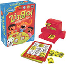 Zingo! game by ThinkFun featuring a colorful box design with children happily playing. The set includes a Zingo! dispenser, game cards, and tokens depicting images like a bird, train, and dog. Perfect for family game nights.