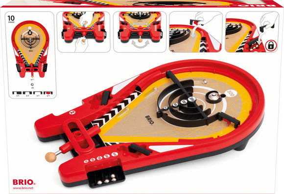 A colorful Trickshot Game by Brio Games, featuring a unique shooting design. The game includes a vibrant red base with a target area featuring numbers and pathways for a ball to roll through. Its layout showcases rotational features for aiming and launching, complete with instructions on the packaging for ease of play.