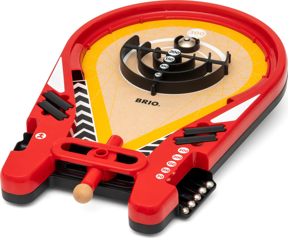 The Trickshot Game by Brio features a colorful board with a yellow surface, black and red accents, and a central rotating element. Players slide a wooden ball into the scoring zones marked with numbers, aiming for high points. The design is engaging and promotes skillful play, making it ideal for family game nights and gatherings.