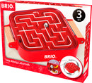 The BRIO Take Along Labyrinth is a mechanical puzzle designed for children ages 3 and up. It features a red maze with an embedded marble that players navigate through tilting the base. The puzzle comes in a colorful cardboard box that highlights the intricate pathways of the maze and showcases a clear view of how the game functions. Ideal for developing fine motor skills and spatial awareness.