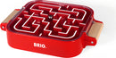 BRIO Take Along Labyrinth is a mechanical puzzle designed for engaging fun. The bright red tray features a maze where a small metal ball can be navigated through the intricate pathways, perfect for enhancing problem-solving skills. The puzzle is portable with convenient wooden handles, making it easy to carry and play anywhere.
