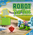 ThinkFun Robot Turtles game box featuring a colorful illustration of a turtle wearing a blue shell with a robotic arm, aiming to collect a red gem amidst a scenic backdrop with icy rocks. The box highlights that this game introduces coding concepts for young players, making it engaging and educational.