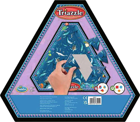 The Triazzles Dolphins mechanical puzzle by Think Fun showcases a vibrant ocean-themed design with various dolphins and sea creatures. A hand is shown arranging colorful triangular pieces to complete the puzzle, set against a blue background. The packaging is hexagonal, decorated with a playful border, highlighting the creative challenge this puzzle offers.
