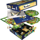 The game Meadow by Rebel displayed with its box and components. The box features beautiful illustrations of butterflies and plants. Inside, various cards, a rulebook, and game boards are arranged in a neat layout, showcasing vibrant graphics depicting nature elements. The game includes pieces that represent a colorful meadow environment.