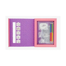 Sweat Treats Shrinkies by Tiger Tribe, open DIY kit showcasing the colorful shrink plastic designs, colored pencils, and accessories in a vibrant pink and purple box.