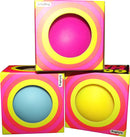 NeeDoh Color Change fidget toy by Schylling Associates Inc. Three colorful spheres in boxes, featuring vibrant pink, blue, and yellow designs with bold circular patterns.