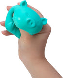 A person holding a turquoise NeeDoh Dig It Pig fidget toy. The toy has a pig shape, featuring cute details like ears and a snout, designed for stress relief and sensory play. Its soft and squishy texture allows for comfortable squeezing and fidgeting.