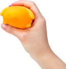 A person is holding the NeeDoh Funky Pup, a bright orange squishy stress toy shaped like a cute dog. The soft, squeezable material allows for fun and stress relief, making it perfect for kids and adults alike.