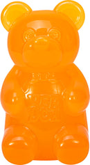 Needoh Gummy Bear by Schylling, a vibrant orange fidget toy designed in the shape of a gummy bear. Its squishy, soft texture makes it perfect for sensory play and stress relief, promoting relaxation.