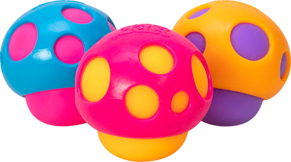 A colorful set of three Needoh Groovy Shrooms by Schylling, featuring a pink mushroom with yellow and purple dots, a blue mushroom with pink dots, and an orange mushroom with purple dots. Each mushroom is designed as a squishy fidget toy, perfect for sensory play and stress relief.