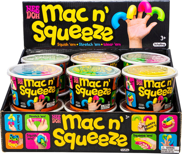 A colorful display of Needoh Mac 'N Squeeze from Schylling, featuring multiple tubs of squishy, stretchy toys in various bright colors, designed for fun and relaxation. A hand is shown wearing colorful finger toys, emphasizing their playful nature.