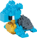 A colorful Nanoblock model of Lapras, featuring blue, gray, and yellow building blocks. The model showcases detailed design, capturing the iconic Pokémon's shape and features.