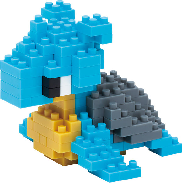 A colorful Nanoblock model of Lapras, featuring blue, gray, and yellow building blocks. The model showcases detailed design, capturing the iconic Pokémon's shape and features.