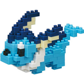 A completed Nanoblock Vaporeon DIY kit, showcasing a small sandy blue aquatic creature made of interlocking plastic blocks. The figure features Vaporeon's distinct fins, large expressive eyes, and a stylish tail, emphasizing detailed construction and vibrant colors.