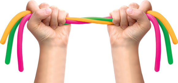 A pair of hands grasping colorful, flexible Noodies in green, pink, orange, and yellow. The hands are pulling the Noodies apart, showcasing their stretchability and vibrant colors.