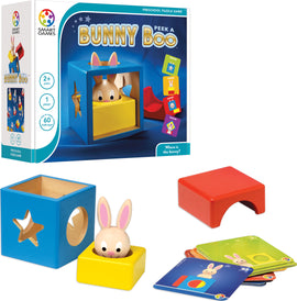 The Bunny Peek A Boo mechanical puzzle by SmartGames features a colorful box with a rabbit partially hidden inside. It includes a blue cube with a star and circle cutout, a yellow base, a red block, and several challenge cards. The game promotes problem-solving and sensory skills in preschoolers, providing various challenges to find the bunny's location.
