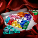 A colorful mechanical puzzle called IQ Love by Smart Toys & Games, featuring vibrant geometric pieces in various colors arranged to form a heart shape on a white board. The background is adorned with rich red fabric, enhancing the visual appeal and highlighting the dazzling, transparent pieces of the puzzle.