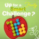 A colorful mechanical puzzle named Apple Twist by Smart Toys & Games, featuring a red apple-shaped base with rows of colorful interlocking pieces in blue, green, and yellow, set against a light green background. The puzzle invites players to challenge their problem-solving skills with a fruity theme.