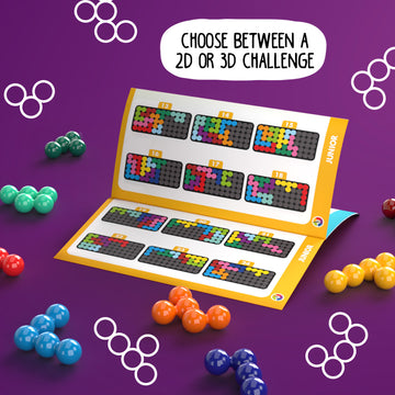 The IQ Puzzler Pro by SmartGames features a vibrant purple background with several colorful spheres scattered around. An open booklet displays various 2D and 3D challenge layouts in bright colors, showcasing the engaging puzzle-solving activities available. Perfect for enhancing logical thinking and spatial skills.