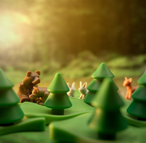 Grizzly Gears by Smart Toys & Games showcases a vibrant mechanical puzzle featuring playful animal figurines, including bears and rabbits, set in a lush green wilderness with stylized trees. This engaging design encourages imaginative play and problem-solving skills as users navigate through this charming forest scene.